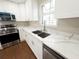 Bright kitchen area featuring stylish countertops, new appliances, and ample lighting at 444 Sargent Se Dr, Atlanta, GA 30315