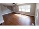 Inviting living room featuring hardwood floors and large windows for natural light at 444 Sargent Se Dr, Atlanta, GA 30315