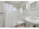 Classic bathroom with a pedestal sink, tiled shower/tub, and built-in shelving at 91 Rumson Ne Rd # C32, Atlanta, GA 30305