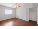Bedroom with hardwood floors, window, ceiling fan, and closet space at 91 Rumson Ne Rd # C32, Atlanta, GA 30305