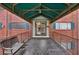 This apartment building's main entrance features a covered walkway with a bench at 91 Rumson Ne Rd # C32, Atlanta, GA 30305