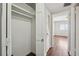 Open closet off the hallway near bedroom with wood floor and white walls at 91 Rumson Ne Rd # C32, Atlanta, GA 30305