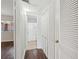 Hallway view leads to a bathroom and bedroom with hardwood floors and ample closet space at 91 Rumson Ne Rd # C32, Atlanta, GA 30305