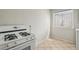 Kitchen featuring a white stove and tile flooring with a window offering natural light at 91 Rumson Ne Rd # C32, Atlanta, GA 30305
