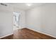 Bright living room featuring hardwood floors, fresh paint, and an open layout leading to the kitchen at 91 Rumson Ne Rd # C32, Atlanta, GA 30305