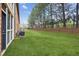 Large backyard with lush green grass and a privacy fence, great for outdoor activities at 1605 Beaumont Cir, Duluth, GA 30096