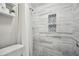 Stylish bathroom with modern tile shower and convenient shelving at 1605 Beaumont Cir, Duluth, GA 30096