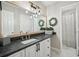 Stylish bathroom featuring a modern vanity, granite countertop, and decorative lighting at 1605 Beaumont Cir, Duluth, GA 30096