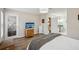 Bright bedroom with hardwood floors, two windows, and a comfortable bed at 1605 Beaumont Cir, Duluth, GA 30096