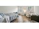Well-lit bedroom featuring hardwood floors and multiple windows with a large bed at 1605 Beaumont Cir, Duluth, GA 30096