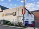 Exterior view of a commercial building featuring a large guitar and 'Rock Roll' signage at 1605 Beaumont Cir, Duluth, GA 30096