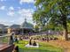 A lively park scene with people relaxing on blankets near buildings on a sunny day at 1605 Beaumont Cir, Duluth, GA 30096