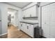Kitchen area featuring white cabinets, granite countertops and stainless steel appliances at 1605 Beaumont Cir, Duluth, GA 30096