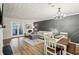 Open concept living room with modern decor, fireplace, and dining area at 1605 Beaumont Cir, Duluth, GA 30096