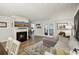 Comfortable living room with fireplace, cozy seating, and natural light from french doors at 1605 Beaumont Cir, Duluth, GA 30096