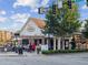 Charming brick restaurant featuring outdoor seating, lush landscaping, and a welcoming entrance at 1605 Beaumont Cir, Duluth, GA 30096