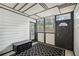 Cozy sun room with tiled floors, paneled walls, and lots of sunlight from the windows at 1605 Beaumont Cir, Duluth, GA 30096