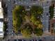 Aerial view of the local community featuring a tree lined median with sidewalks and parking spaces at 174 Sidney St, Marietta, GA 30060