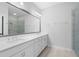 Bright bathroom with double sink vanity, large mirror, and glass door shower at 174 Sidney St, Marietta, GA 30060