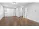 Spacious bedroom with hardwood floors, built-in shelves, a Murphy bed, and access to multiple closets at 174 Sidney St, Marietta, GA 30060