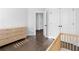Bedroom featuring wooden crib, closet, and hardwood floors at 174 Sidney St, Marietta, GA 30060