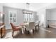 Open dining area with hardwood floors, plantation shutters, and modern lighting at 174 Sidney St, Marietta, GA 30060