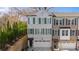 Beautiful new construction townhome featuring painted brick, three stories, and an attached two car garage at 174 Sidney St, Marietta, GA 30060