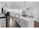 Modern kitchen featuring a large island, stainless appliances, and a view of the dining area at 174 Sidney St, Marietta, GA 30060