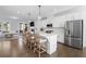 Open concept kitchen with stainless steel appliances, modern fixtures and bar seating at 174 Sidney St, Marietta, GA 30060