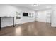 Open floor plan living room with hardwood floors, natural light, and built-in cabinets at 174 Sidney St, Marietta, GA 30060