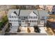 A bird's-eye view of new townhomes featuring brick and stone exteriors and individual garages at 174 Sidney St, Marietta, GA 30060