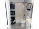 Functional bathroom with a shower-tub combo, modern fixtures, and stylish decor for a clean and comfortable space at 998 Allene Sw Ave, Atlanta, GA 30310