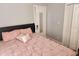Bright bedroom featuring a comfortable bed with plush bedding and a convenient closet for ample storage at 998 Allene Sw Ave, Atlanta, GA 30310