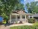 Charming single-story home with a welcoming front porch and well-maintained landscaping, perfect for relaxing outdoors at 998 Allene Sw Ave, Atlanta, GA 30310