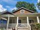 Charming home featuring a welcoming front porch, mature trees, and a beautifully maintained exterior at 998 Allene Sw Ave, Atlanta, GA 30310
