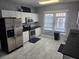 Modern kitchen with stainless steel appliances, stylish backsplash, and ample counter space for a delightful cooking experience at 998 Allene Sw Ave, Atlanta, GA 30310