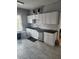 Bright kitchen with ample cabinet space, stainless steel dishwasher, and modern countertops, perfect for cooking and entertaining at 998 Allene Sw Ave, Atlanta, GA 30310