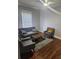Cozy living room with hardwood floors, comfortable seating, and ample natural light, ideal for relaxation and gatherings at 998 Allene Sw Ave, Atlanta, GA 30310