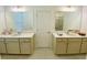 Bathroom with double vanity, framed mirrors, and tile flooring at 2785 Lifford Way, Duluth, GA 30097