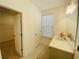 Bathroom with tile flooring, vanity, mirror, and walk-in closet at 2785 Lifford Way, Duluth, GA 30097