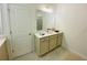 Bright bathroom with vanity, large mirror, and neutral color scheme at 2785 Lifford Way, Duluth, GA 30097