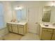 Bathroom with double vanity, white countertops, and tile flooring at 2785 Lifford Way, Duluth, GA 30097