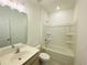 Well-lit bathroom with a shower-tub combo, vanity with sink, and a practical design for daily routines at 2785 Lifford Way, Duluth, GA 30097