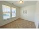 Cozy bedroom with carpet flooring, a window with blinds, and ample natural light at 2785 Lifford Way, Duluth, GA 30097