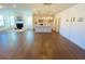 Bright living room featuring hardwood floors, a fireplace, and an open-concept kitchen with stainless steel appliances at 2785 Lifford Way, Duluth, GA 30097