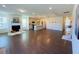 Spacious living room boasts hardwood floors, a fireplace, and an open layout with a modern kitchen and island at 2785 Lifford Way, Duluth, GA 30097