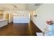 Bright living room featuring hardwood floors, modern chandelier, and access to other rooms at 2785 Lifford Way, Duluth, GA 30097
