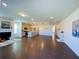 Hardwood floor living room showcases a fireplace and seamlessly connects to a modern kitchen with a central island at 2785 Lifford Way, Duluth, GA 30097