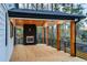 Back deck featuring wood burning fireplace and wood beam ceiling at 2179 Marann Ne Dr, Atlanta, GA 30345