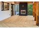 Back deck features a stone fireplace, wood ceiling, and black railings at 2179 Marann Ne Dr, Atlanta, GA 30345